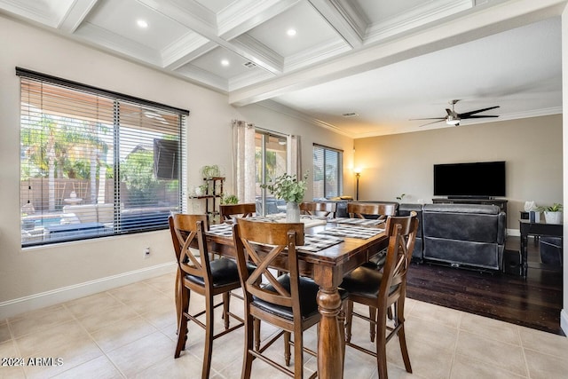 dining area with beam ceiling, plenty of natural light, and light tile patterned floors