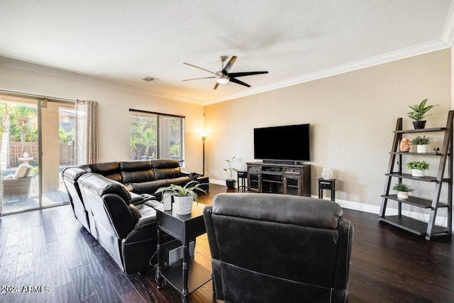 living area featuring visible vents, crown molding, baseboards, and wood finished floors