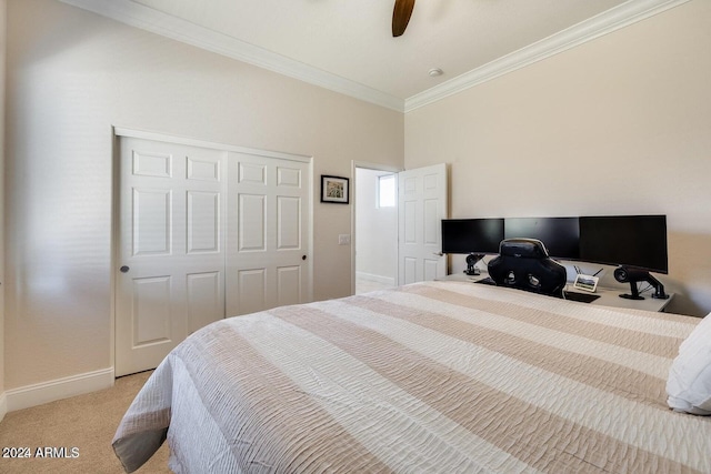 bedroom with baseboards, light colored carpet, ornamental molding, a closet, and a ceiling fan