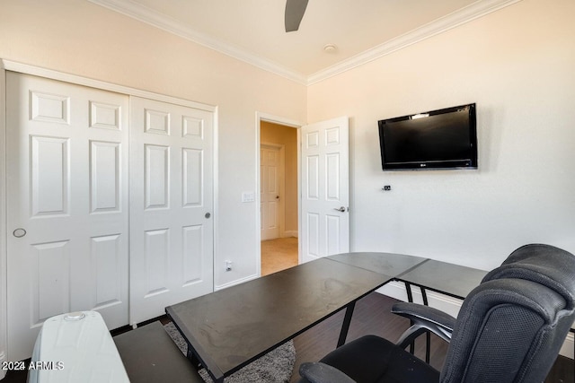 office area with wood finished floors, ornamental molding, and a ceiling fan