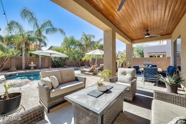 view of patio / terrace featuring a fenced in pool, an outdoor hangout area, a fenced backyard, and ceiling fan