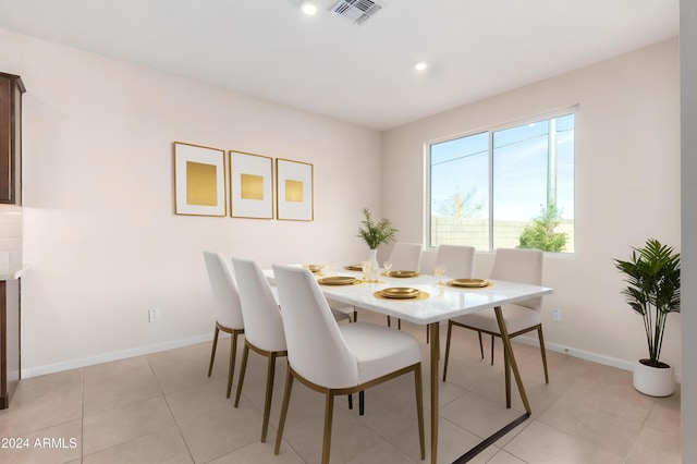 dining area featuring light tile patterned floors