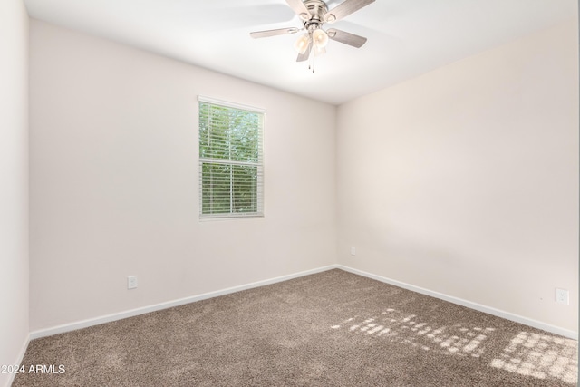 empty room featuring ceiling fan and carpet floors