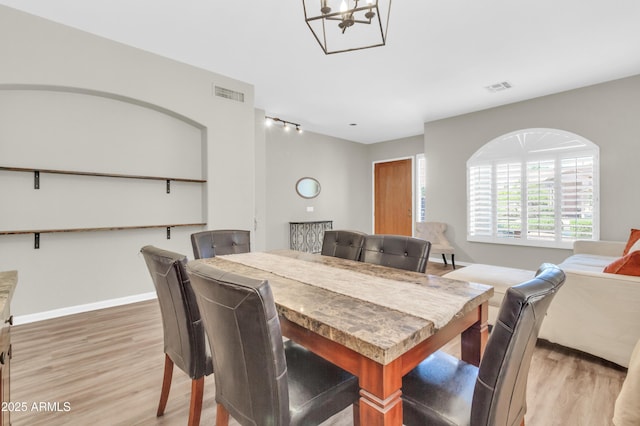 925 W San Marcos Dr, Chandler, AZ 85225 - dining area featuring wood finished floors and a chandelier