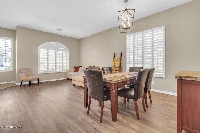 925 W San Marcos Dr, Chandler, AZ 85225 - dining space with light wood-type flooring and a chandelier