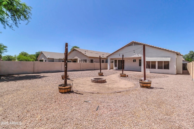 925 W San Marcos Dr, Chandler, AZ 85225 - rear view of house with a fenced backyard, a fire pit, stucco siding, a patio, and a tile roof