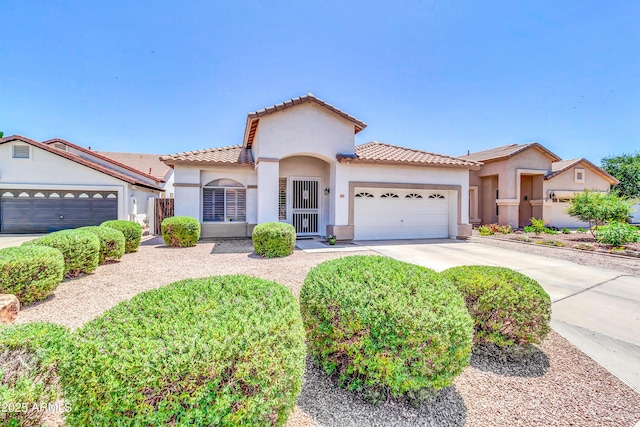 925 W San Marcos Dr, Chandler, AZ 85225 - mediterranean / spanish house featuring a tile roof, stucco siding, an attached garage, and concrete driveway