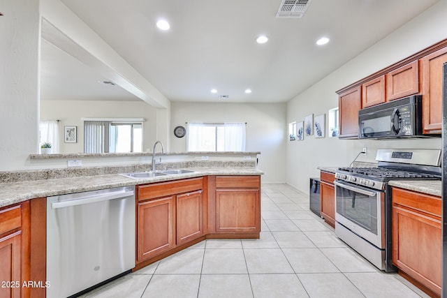 kitchen featuring light tile patterned floors, recessed lighting, visible vents, appliances with stainless steel finishes, and a sink