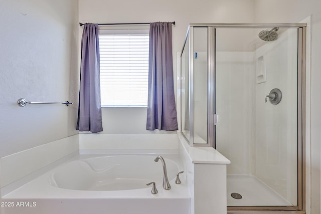 full bath with a garden tub and a shower stall