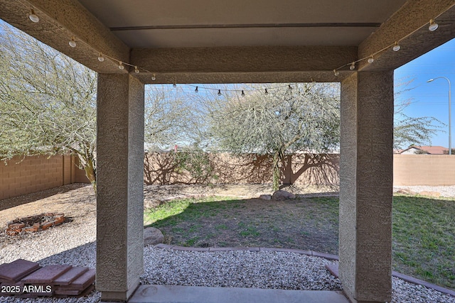 view of yard featuring a patio area and a fenced backyard