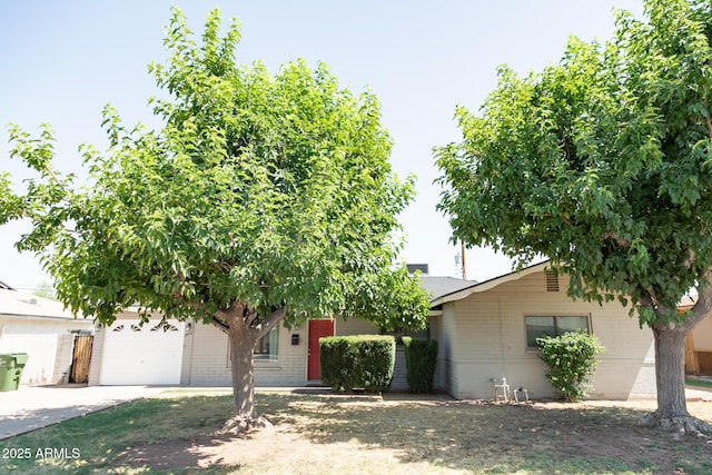 1412 W 7th Pl, Tempe, AZ 85281 - view of front of house featuring brick siding, driveway, and a garage