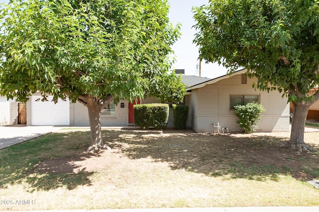 1412 W 7th Pl, Tempe, AZ 85281 - obstructed view of property featuring brick siding, driveway, and roof with shingles