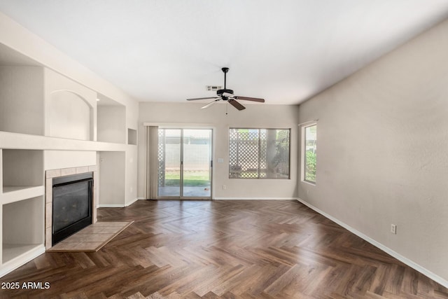 12814 W Indianola Ave, Avondale, AZ 85392 - unfurnished living room with a wealth of natural light, a ceiling fan, and baseboards