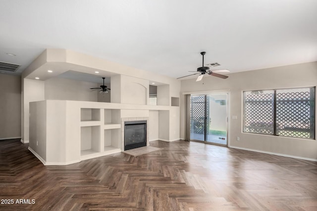 12814 W Indianola Ave, Avondale, AZ 85392 - unfurnished living room featuring baseboards, a ceiling fan, and visible vents