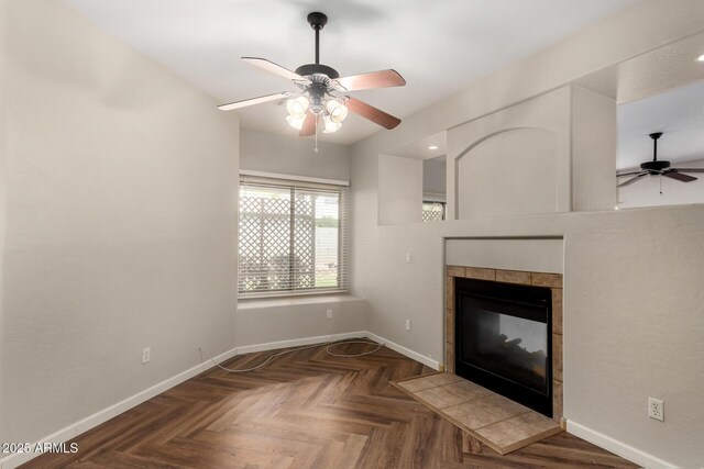 12814 W Indianola Ave, Avondale, AZ 85392 - unfurnished living room with a tile fireplace, baseboards, and ceiling fan