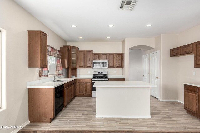12814 W Indianola Ave, Avondale, AZ 85392 - kitchen with recessed lighting, visible vents, stainless steel appliances, arched walkways, and a sink