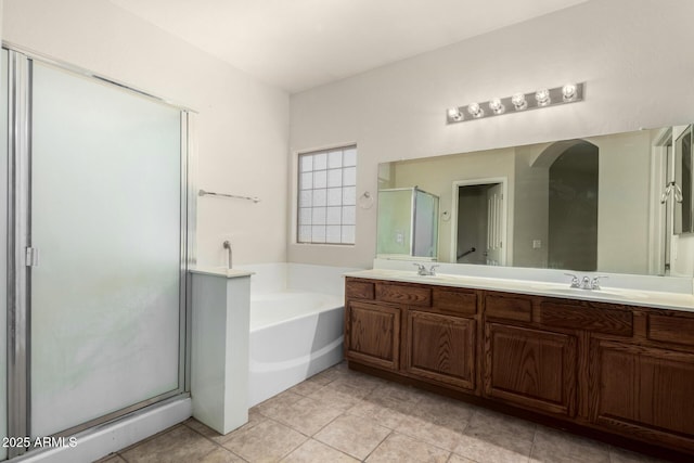 12814 W Indianola Ave, Avondale, AZ 85392 - full bath featuring a bath, a sink, a shower stall, double vanity, and tile patterned flooring