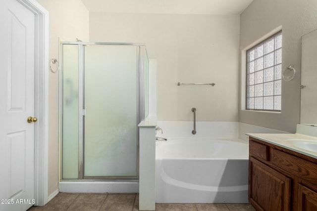 12814 W Indianola Ave, Avondale, AZ 85392 - full bathroom with tile patterned flooring, vanity, a bath, and a stall shower