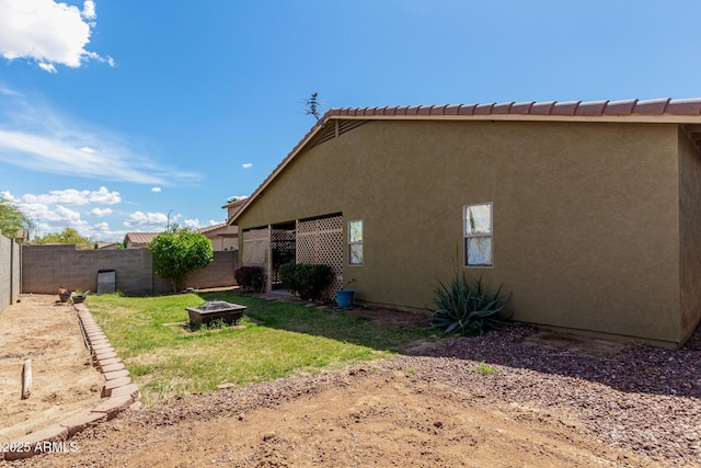 12814 W Indianola Ave, Avondale, AZ 85392 - view of property exterior featuring fence, a lawn, and stucco siding