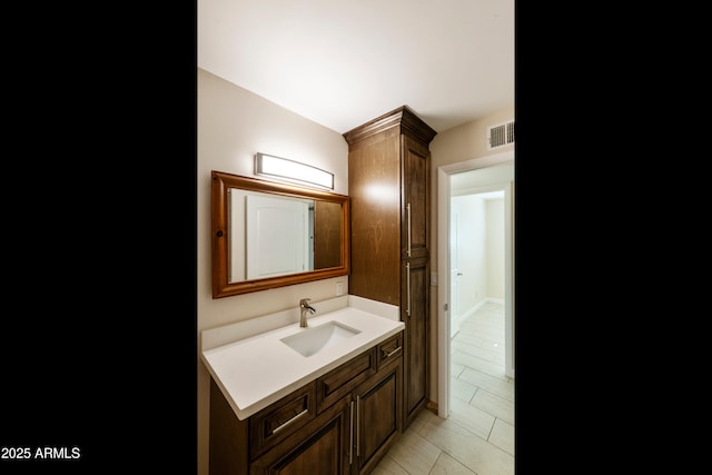 bathroom with vanity and visible vents