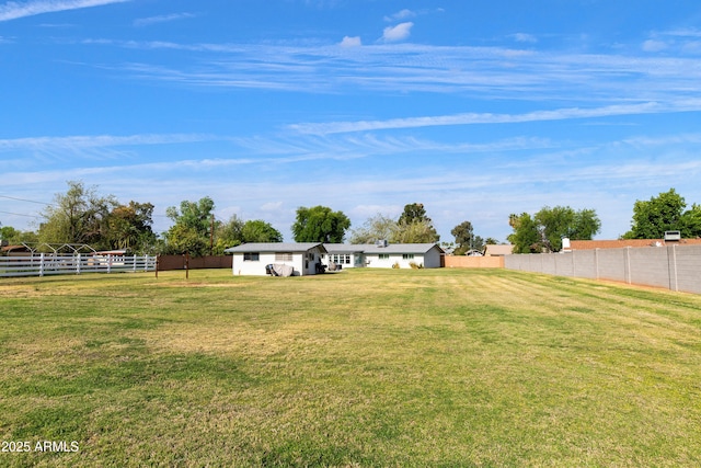 view of yard featuring fence