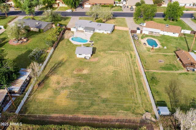 birds eye view of property with a residential view