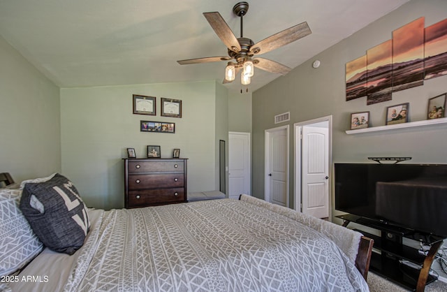 bedroom with lofted ceiling, a ceiling fan, and visible vents