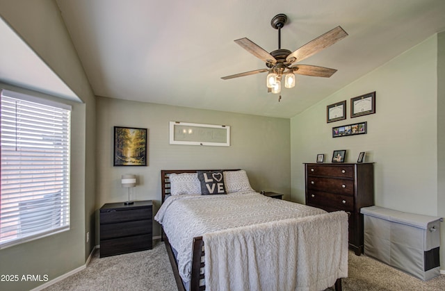 bedroom with ceiling fan, lofted ceiling, baseboards, and light carpet