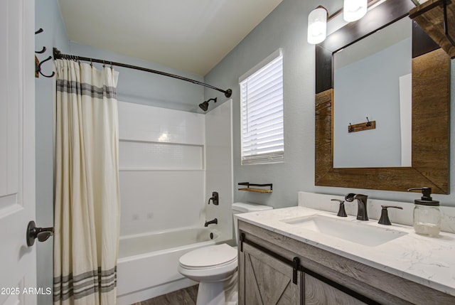 full bath with vanity, toilet, and shower / bath combo with shower curtain