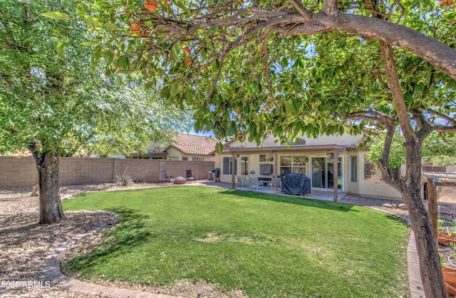 view of yard featuring a patio and a fenced backyard