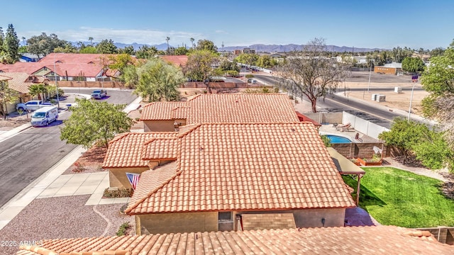 birds eye view of property featuring a mountain view and a residential view