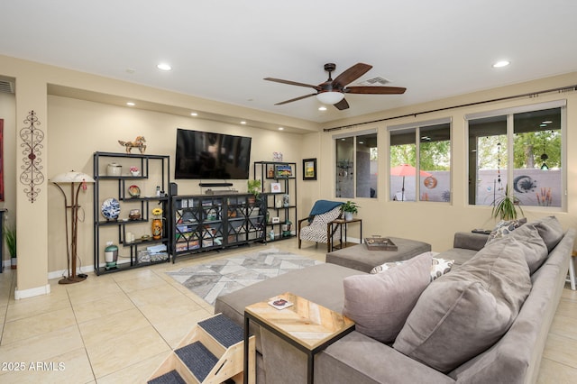 living area with baseboards, recessed lighting, light tile patterned floors, a ceiling fan, and visible vents