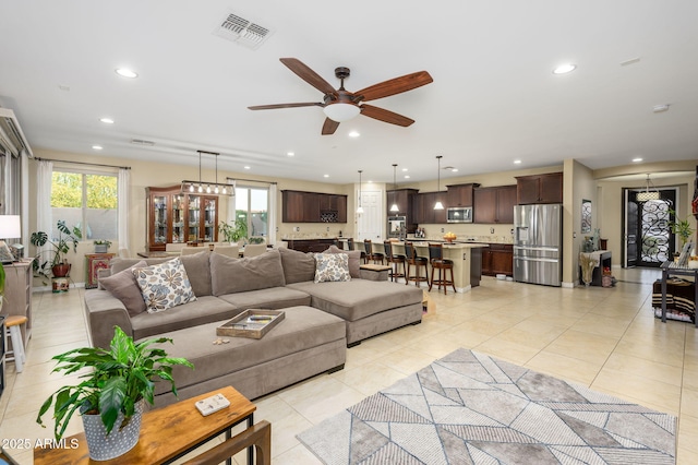 living room with plenty of natural light, recessed lighting, visible vents, and ceiling fan