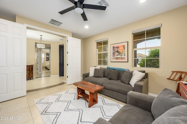 living area with visible vents, baseboards, light tile patterned floors, a ceiling fan, and recessed lighting