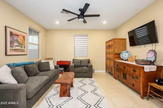 living area featuring light tile patterned floors, ceiling fan, visible vents, recessed lighting, and baseboards