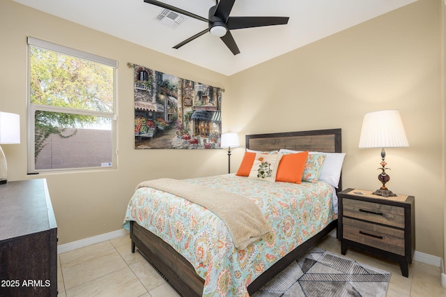 tiled bedroom with ceiling fan, baseboards, and visible vents