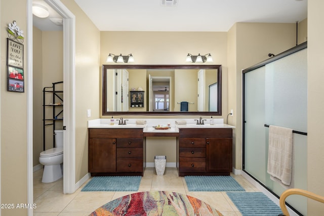 full bathroom with double vanity, a sink, tile patterned flooring, and visible vents