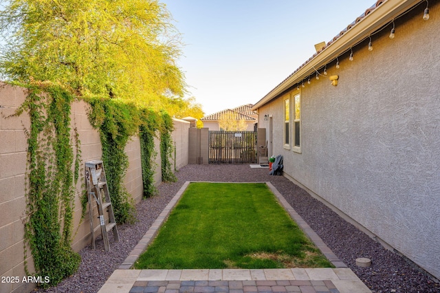 view of yard with a fenced backyard