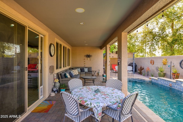view of patio / terrace featuring a fenced in pool, outdoor dining space, outdoor lounge area, grilling area, and fence