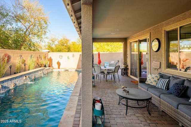 view of patio with a fenced backyard, outdoor dining space, a fenced in pool, and an outdoor hangout area