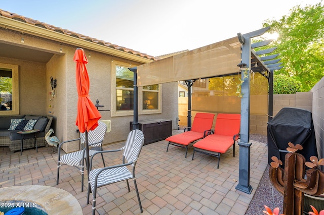 view of patio with grilling area, a pergola, fence, and an outdoor hangout area