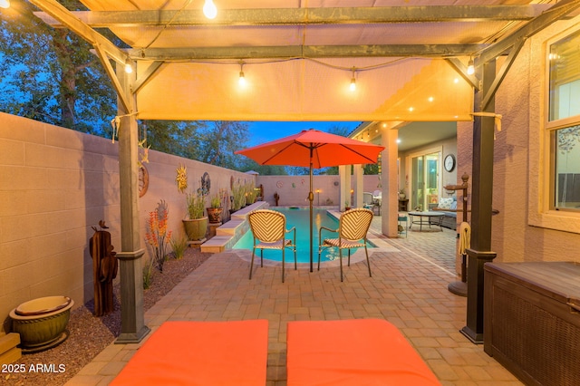 view of patio / terrace featuring a fenced backyard and a fenced in pool