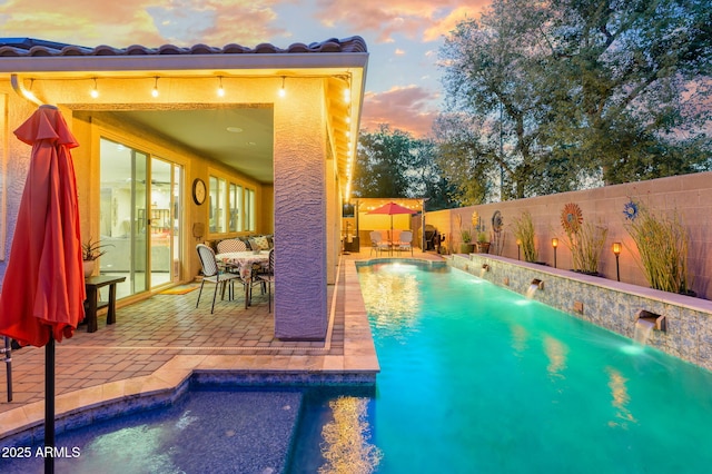 view of swimming pool featuring a patio, a fenced backyard, and a fenced in pool
