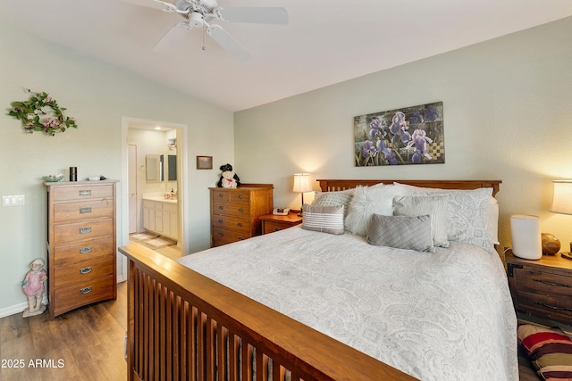 4674 E Alfalfa Dr, Gilbert, AZ 85298 - bedroom with ceiling fan, vaulted ceiling, ensuite bath, and wood finished floors