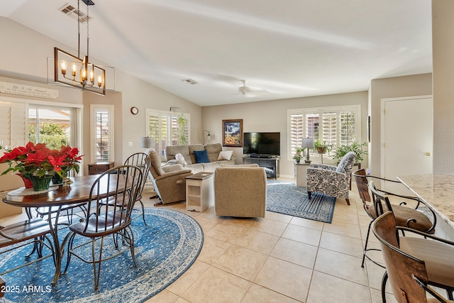 4674 E Alfalfa Dr, Gilbert, AZ 85298 - living area featuring lofted ceiling, light tile patterned floors, plenty of natural light, and ceiling fan with notable chandelier