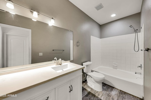 full bathroom with hardwood / wood-style floors, vanity, toilet, and bathtub / shower combination