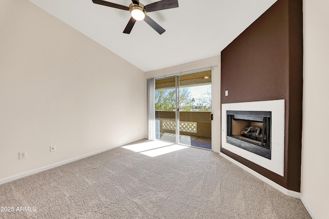 unfurnished living room with light colored carpet, vaulted ceiling, and ceiling fan