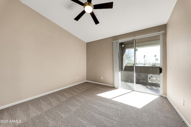 spare room with ceiling fan, carpet, and vaulted ceiling