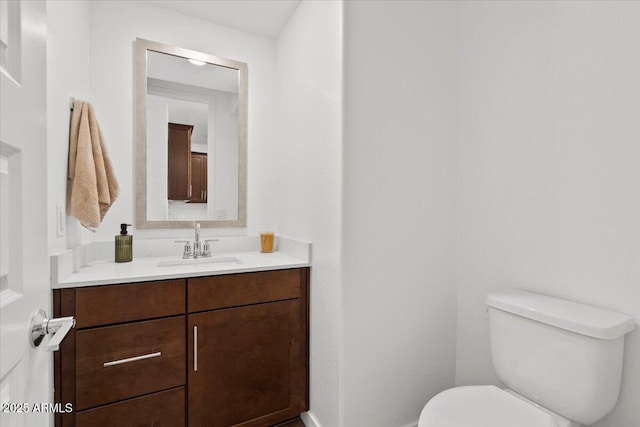 bathroom with toilet and vanity