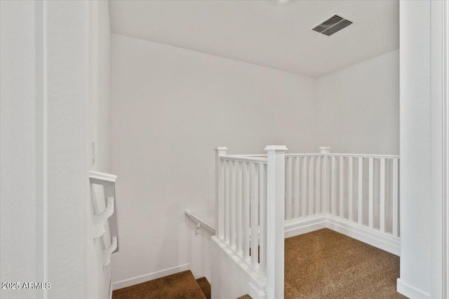 stairs featuring carpet floors and visible vents